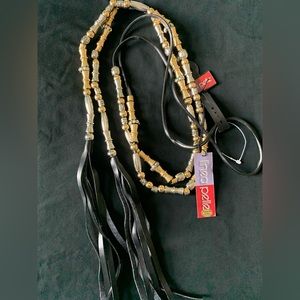 Leather belt adorned with silver and gold design pieces adjusting